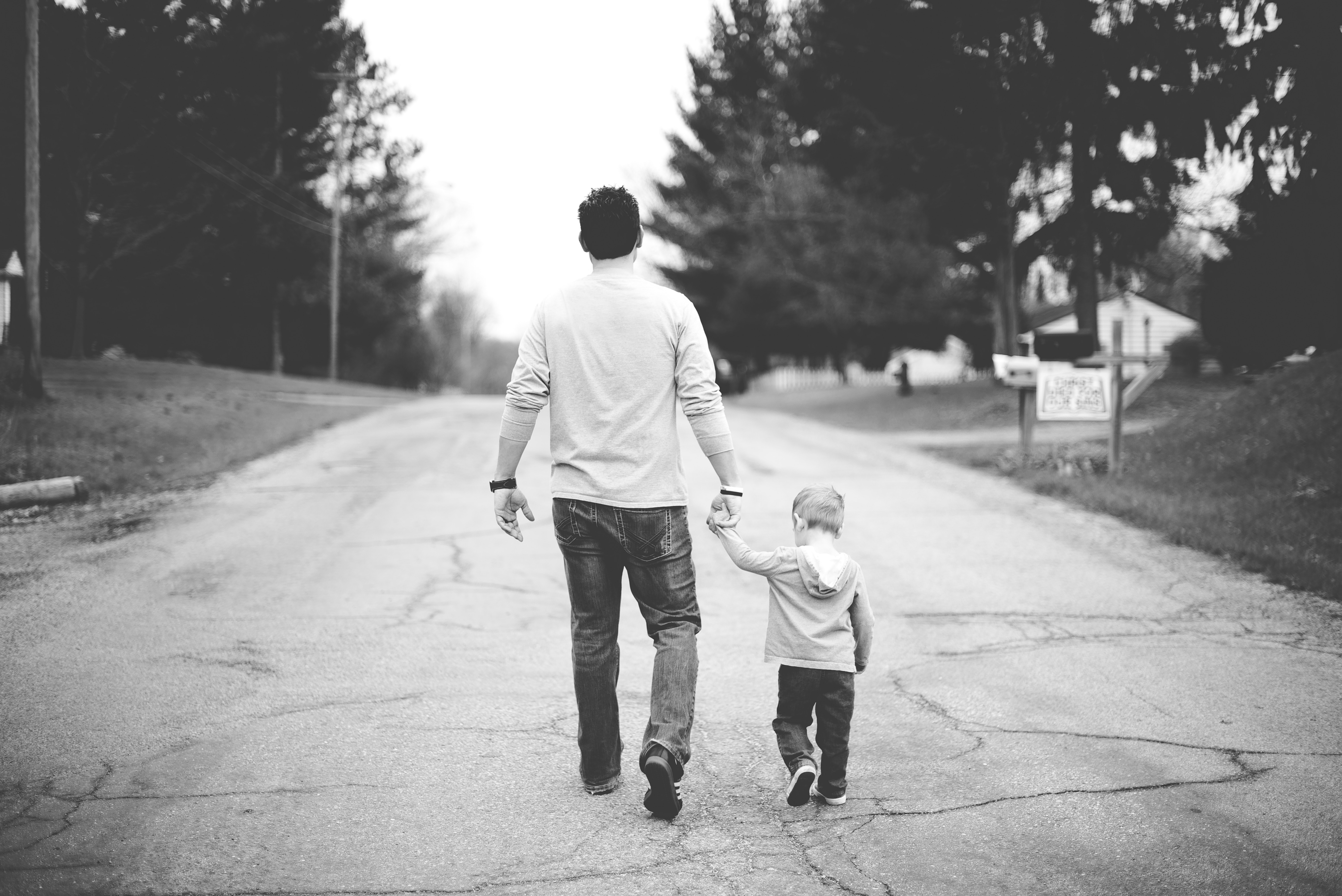 Father and young son walking together